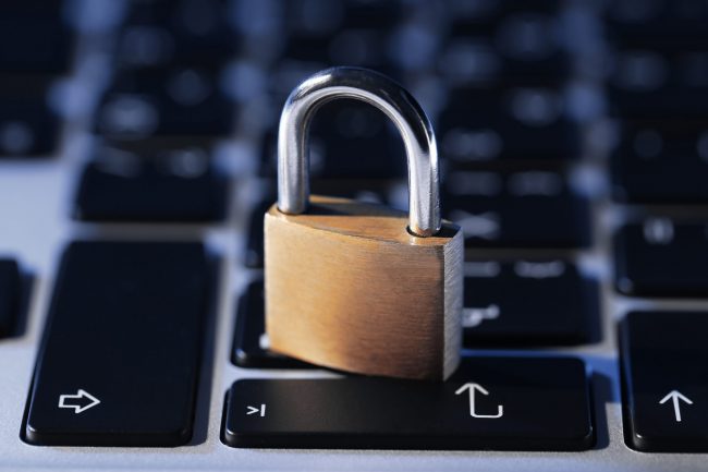 Cyber safety concept – lock on computer keyboard